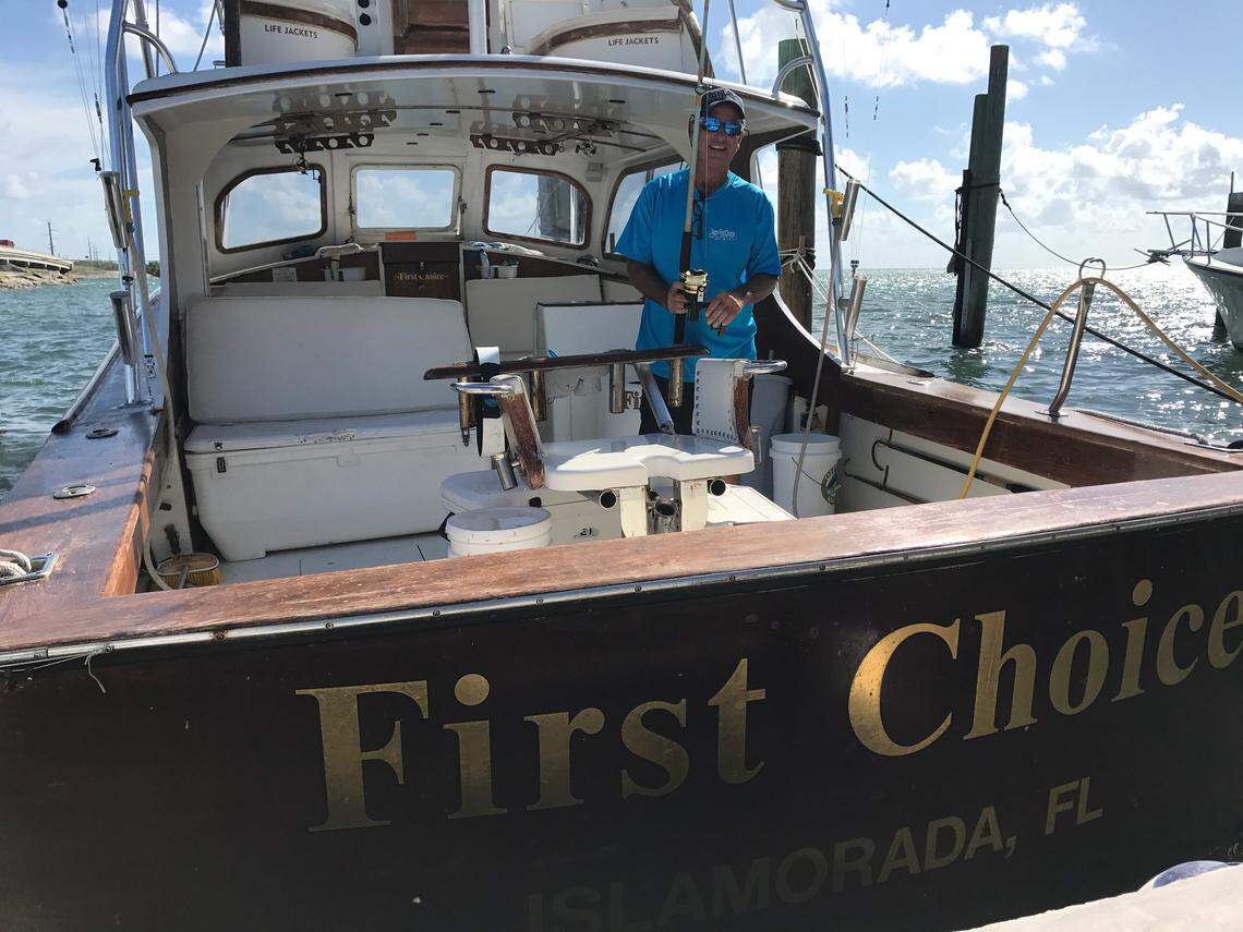 Larry Wren, captain of the First Choice, services a rod and reel on the back of his boat docked at Whale Harbor Marina in Islamorada on Tuesday, Aug. 28, 2018.