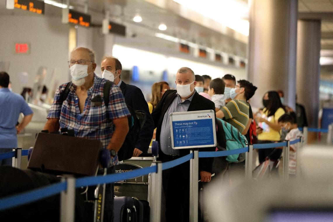 Large crowds are seen at Miami International Airport on Thursday, May 27, 2021, as more than 660,000 passengers are expected during the Memorial Day holiday weekend from May 27 through June 1, for a daily average of 110,000 travelers, which would make it the busiest travel period at the airport since the pandemic began.