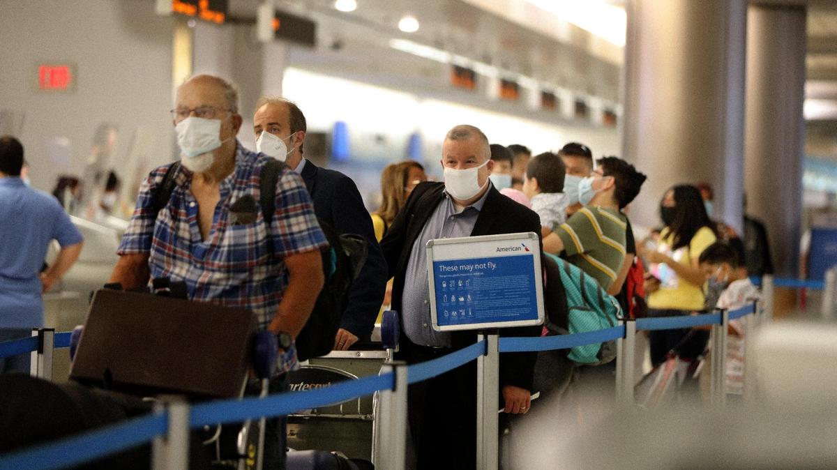 Large crowds are seen at Miami International Airport on Thursday, May 27, 2021, as more than 660,000 passengers are expected during the Memorial Day holiday weekend from May 27 through June 1, for a daily average of 110,000 travelers, which would make it the busiest travel period at the airport since the pandemic began.