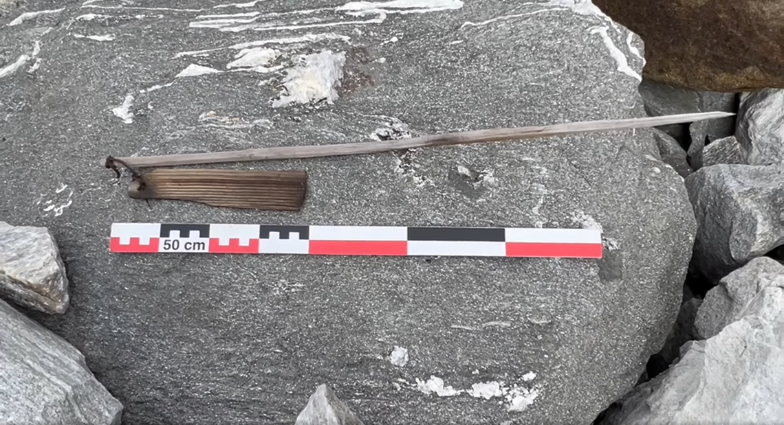 A well-preserved scaring stick with a movable flag.