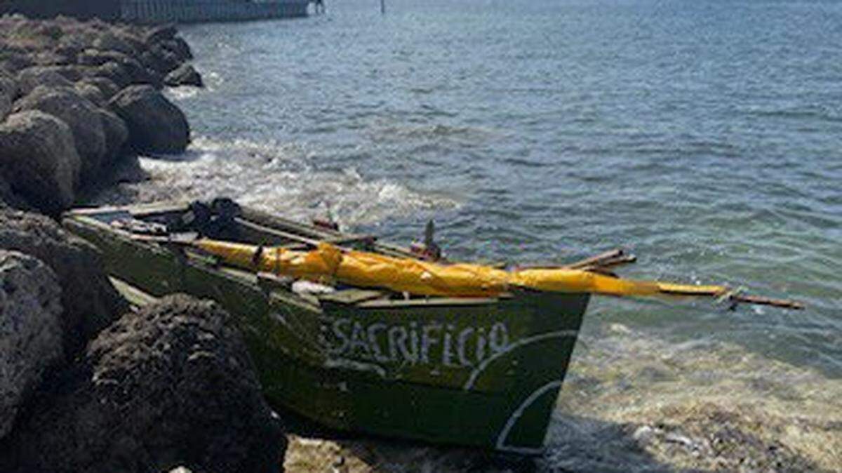 A Cuban migrant boat is moored in the rocks off Truman Waterfront Park in Key West Monday, July 3, 2023. The Border Patrol said three men came to shore on the vessel.