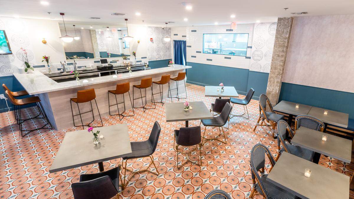 New York upscale casual restaurant Whitmans is now open in Miami Beach.