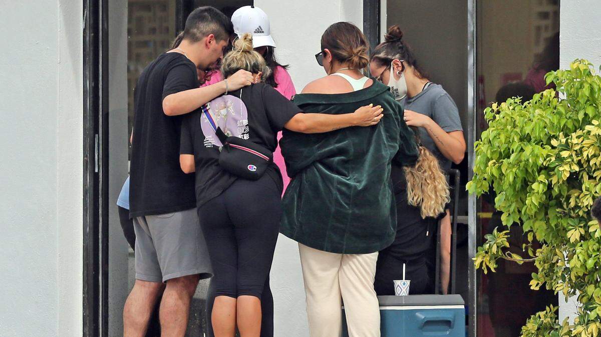 People outside of CASA Church gather for prayers on Friday, June 25, 2021 a day after a 12-story oceanfront condo, Champlain Towers South, collapsed in the town of Surfside.