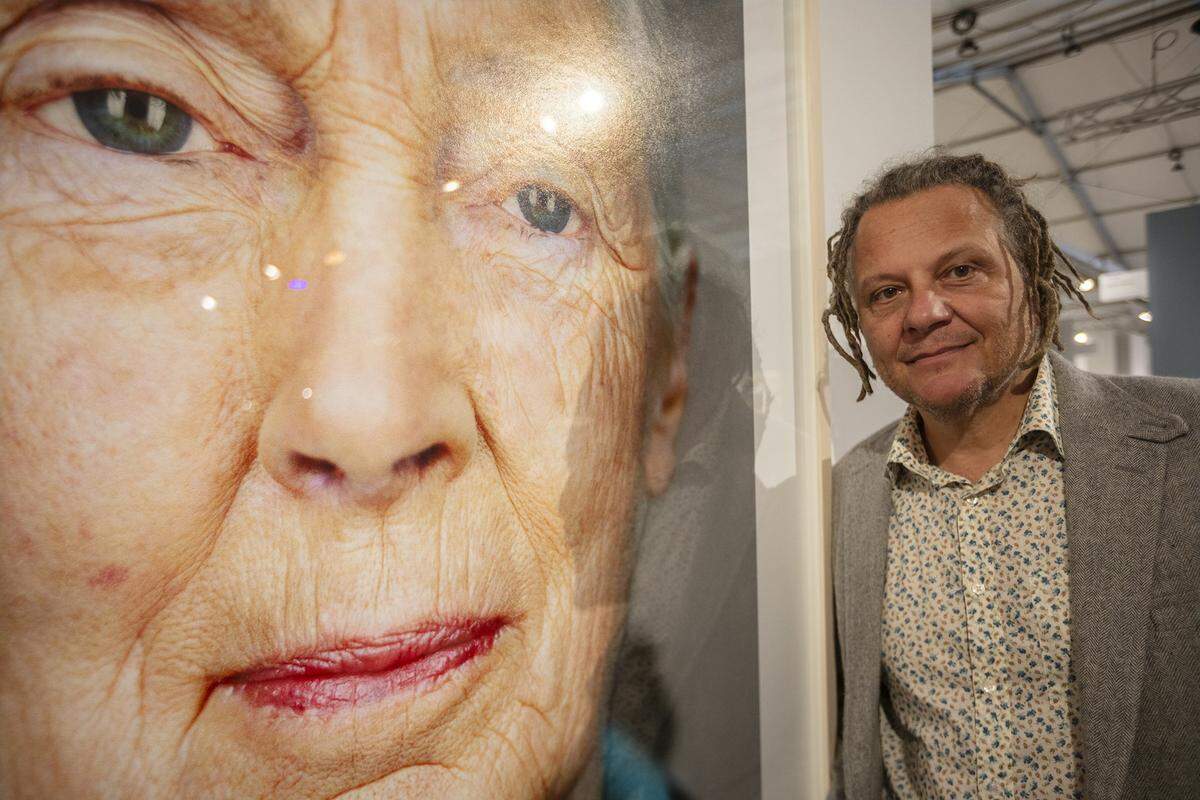 Martin Schoeller poses in front of his photography “Dr. Jane Goodall” · 2010 · Archival Pigment Print at at ART MIAMI in MIami on Tuesday December 2nd., 2025.
