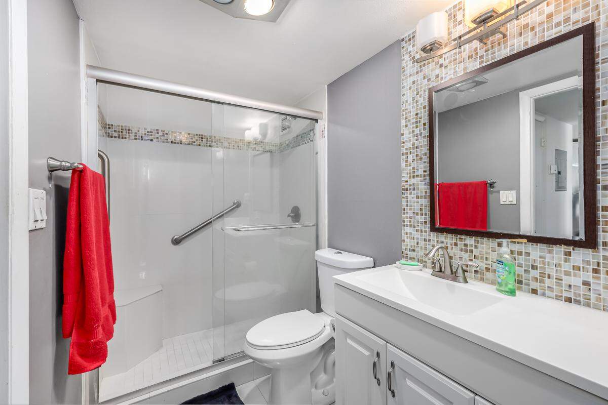 The South Beach apartment comes with a single bathroom, pictured above, decorated with mosaic tile.