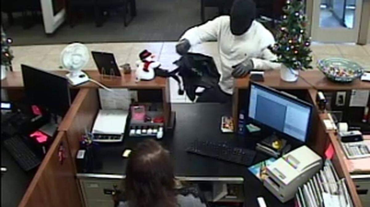 The FBI released photos of a man who investigators say robbed a Dania Beach Centennial Bank branch Dec. 24, 2019.