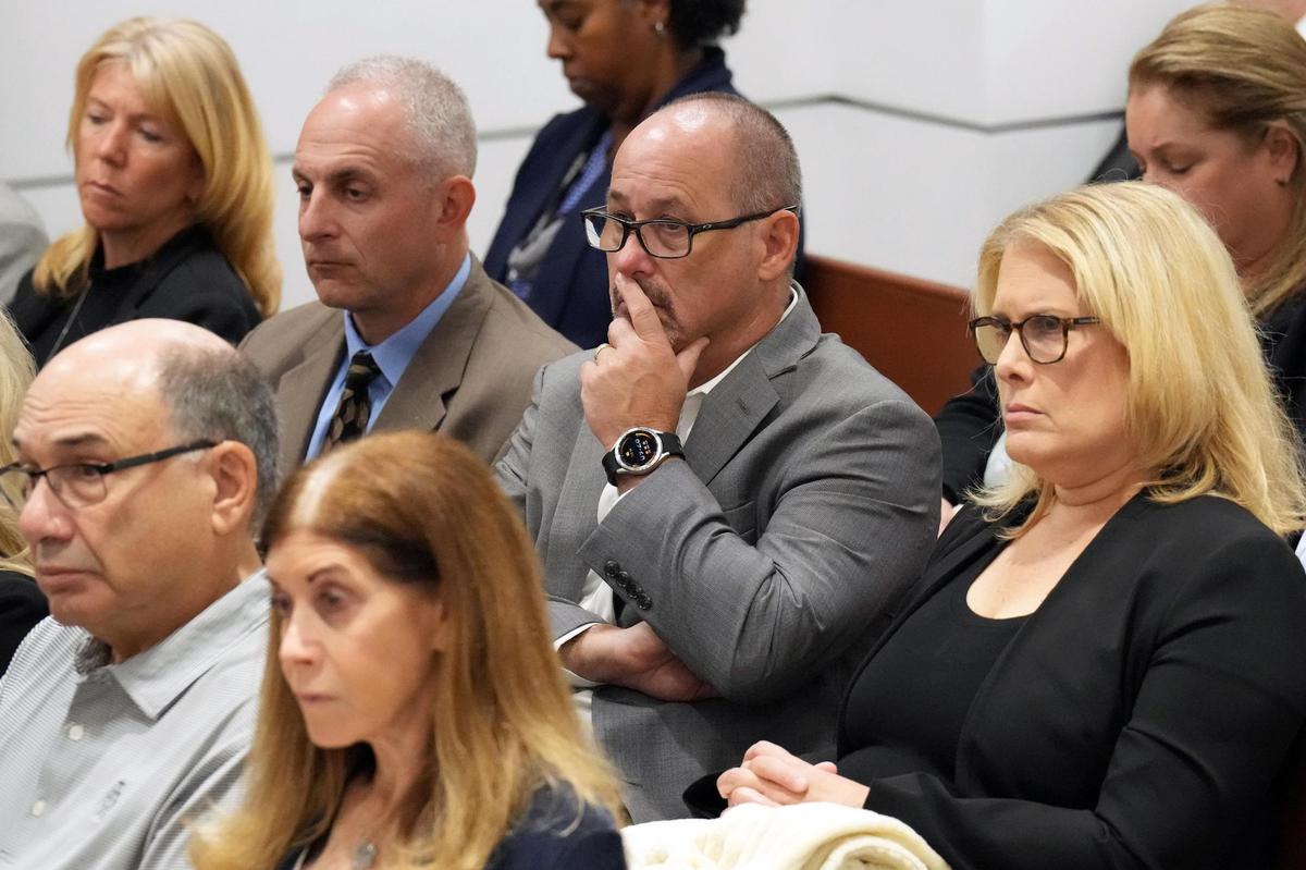 Fred and Jennifer Guttenberg are shown seated with family members of the victims as prosecutor Mike Satz details the killings in his closing arguments in the penalty phase of the trial of Marjory Stoneman Douglas High School shooter Nikolas Cruz at the Broward County Courthouse in Fort Lauderdale on Tuesday, Oct. 11, 2022. The Guttenbergs’ daughter, Jaime, was killed in the 2018 shootings