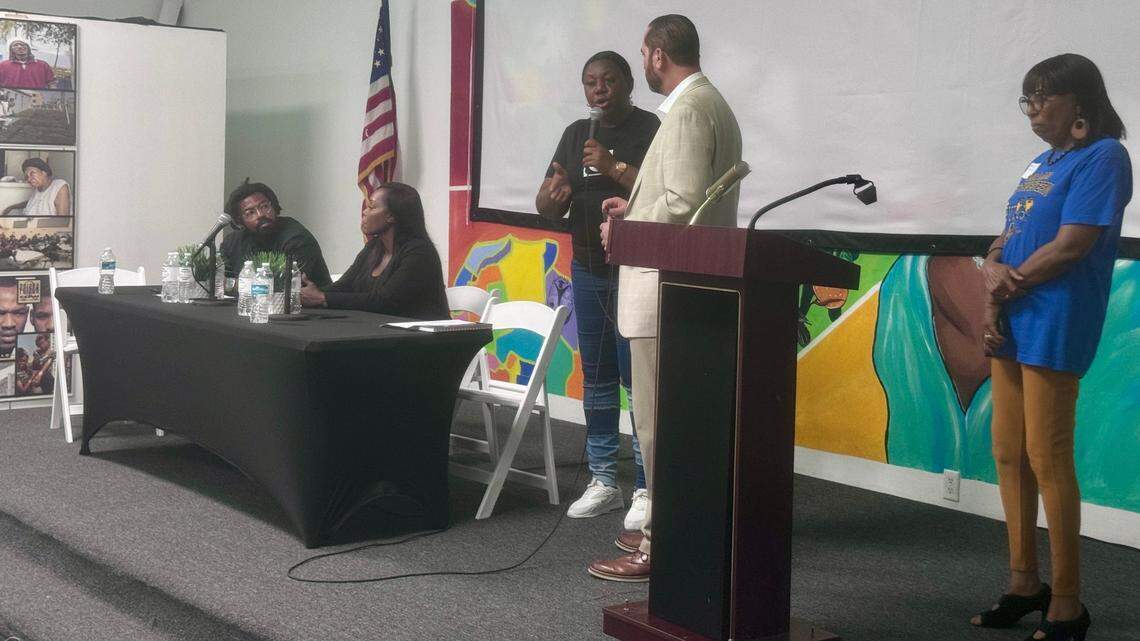(From left to right) Phil Agnew, Samantha Quarterman, Trenise Bryant, Alex Ballina and Anna Williams on stage at the Liberty Square town hall. More than 100 Liberty Square residents and community advocates came out as tenants voiced their concerns about the property’s mold and structural damages.