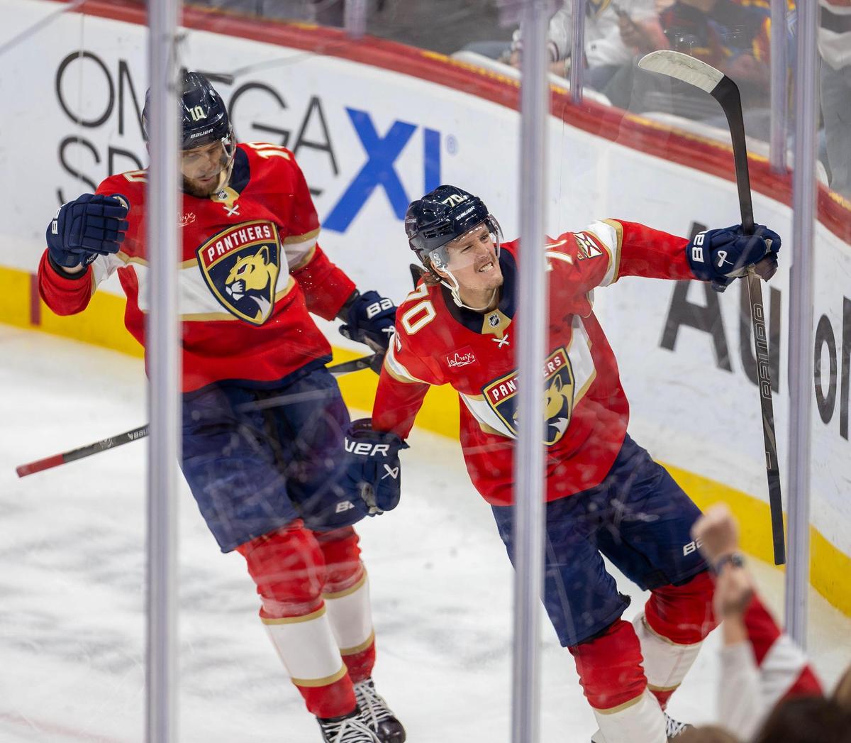 Florida Panthers center Jesper Boqvist (70) celebrates with teammate A.J. Greer (10) after scoring against the Anaheim Ducks during the second period of an NHL of an game at Amerant Bank Arena on Saturday, Jan. 18, 2025, in Sunrise, Fla.