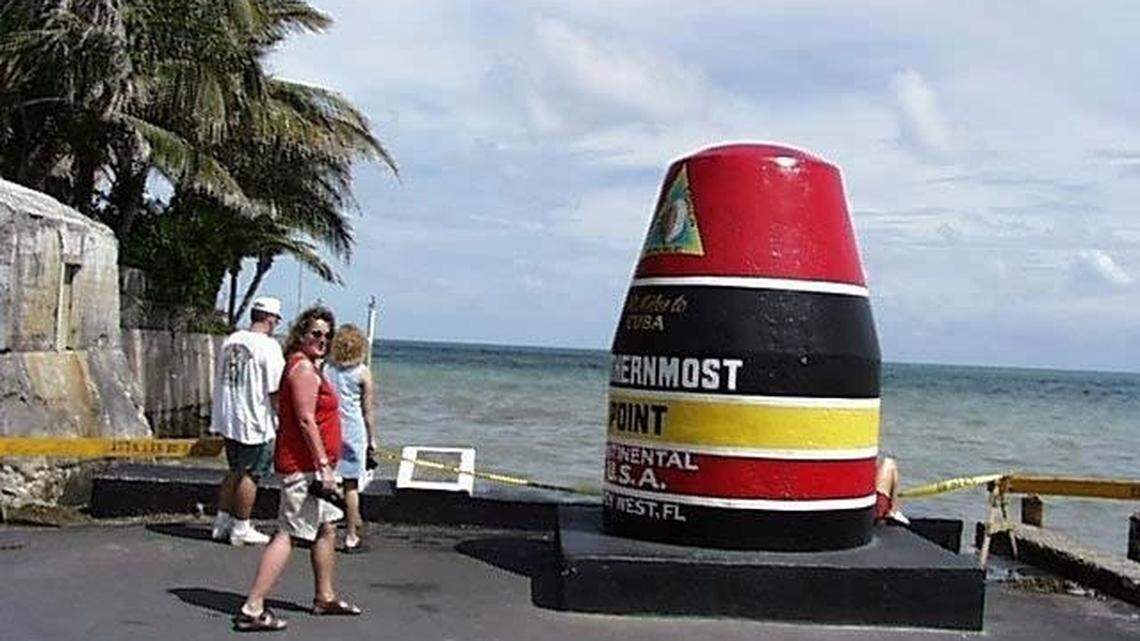 The Southernmost Point buoy is a popular Key West attraction where people wait in line to take pictures in front of it.