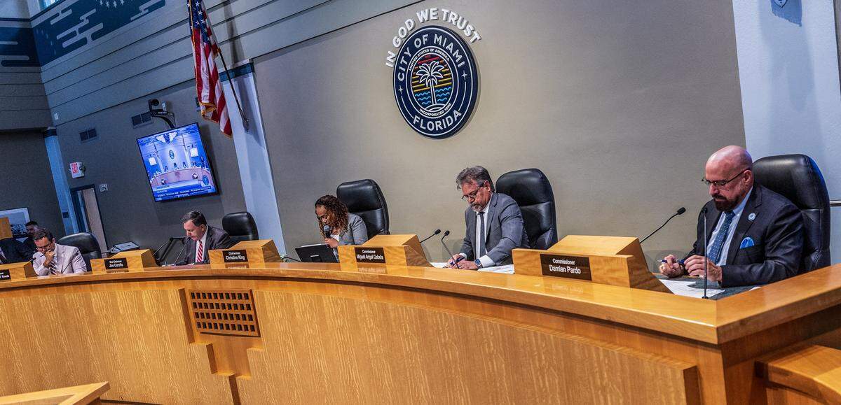 From left-City of Miami Commissioners Ralph "Rafael" Rosado, Vice Chairman Joe Carollo, Chairwoman Christine King, Miguel Angel Gabela and Damian Pardo, during a Commission meeting to discuss the proposed sale of the Olympia Theater at the Gusman Center for the Performing Arts' entire building to a public charter school, called Sports Leadership Arts Management, (SLAM), at City Hall, on Thursday September 25, 2025.