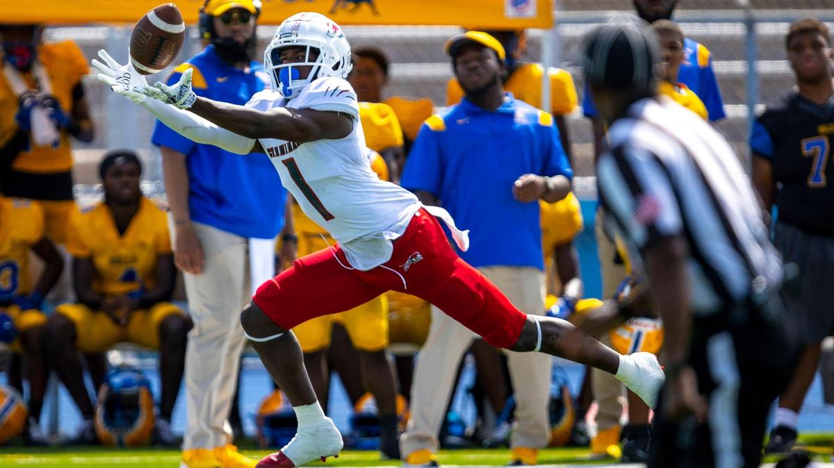 Chaminade-Madonna athlete Joshisa Trader (1) stretches for the catch during the first quarter of a high school football game against Miami Northwestern at Nathaniel Traz Powell Stadium in Westview, Florida, on Saturday, September 10, 2022.