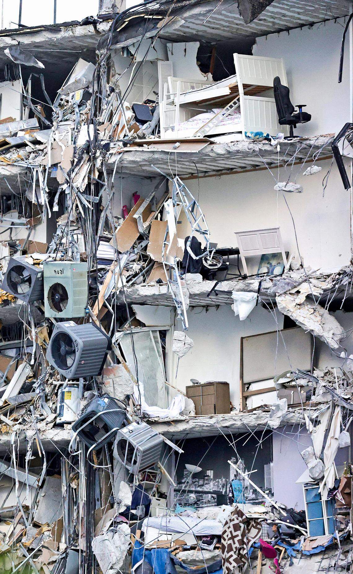 The rubble is seen at Champlain Towers South condo in Surfside, located at 8777 Collins Avenue, a part of which collapsed in the early morning of Thursday, June 24, 2021.