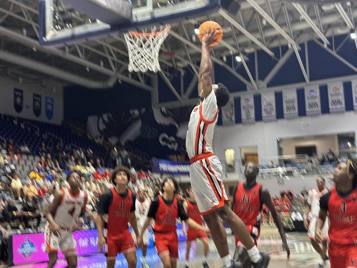 Sagemont guard Ezra Gelin soars for a dunk during Saturday’s Class 1A state championship game against Lakeland Victory Christian at the UNF Arena in Jacksonville, Fla.