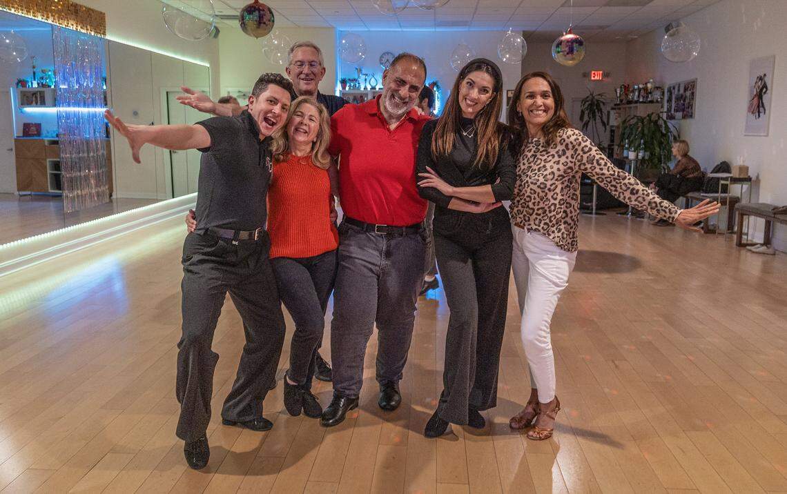 From left-Dance instructor Stefan Ilies, students Stuart Ratner, Maggie and Edward Fazzah, instructor Daniela Vacaru and student Cecilia Calderon posed for a picture, during a class at Let's Dance Miami studio in Aventura, on Wednesday, February 18, 2026.