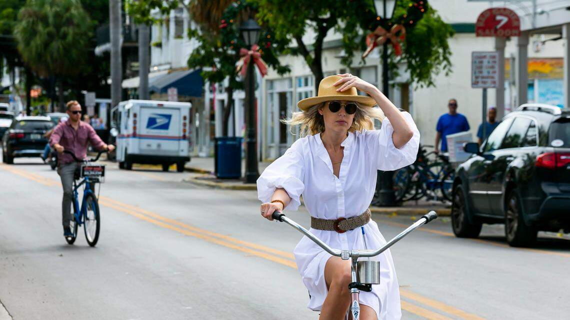 Cyclists make their way down Duval Street in Key West, Florida on Sunday, December 12, 2021.