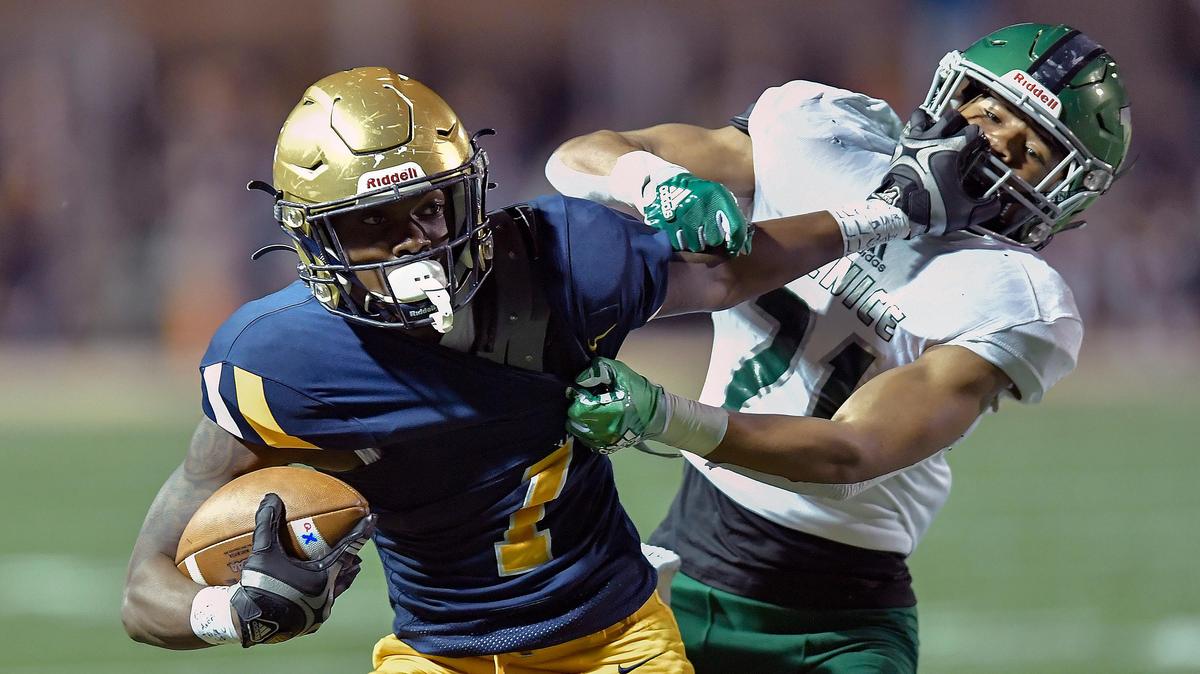St. Thomas Aquinas receiver The’Andris Freeman gets past Venice DB Elliot Washington during the first half of their game, Friday, November 29, 2019.