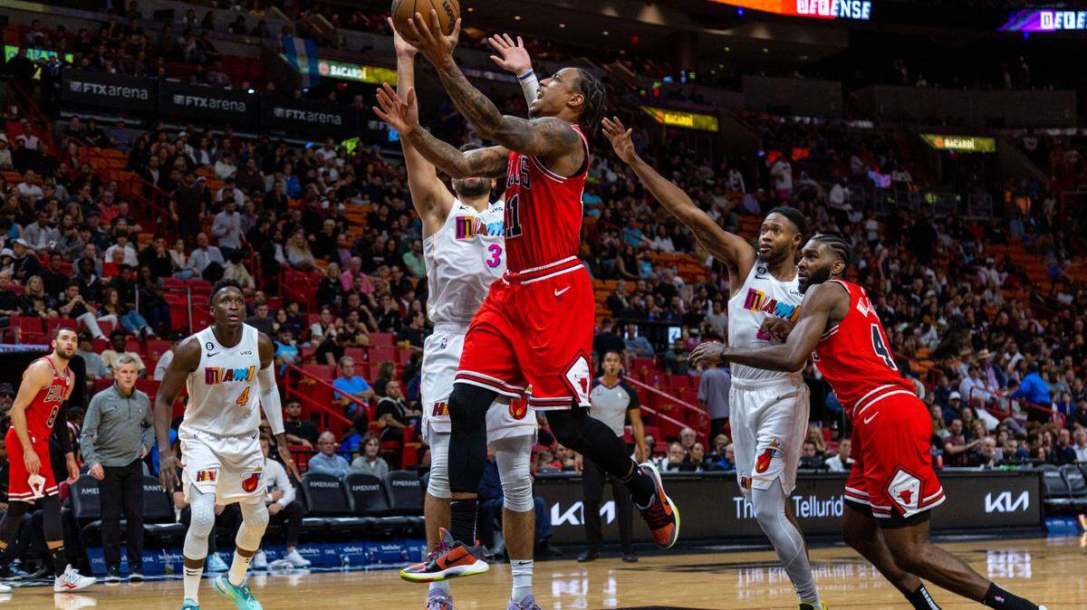 Chicago Bulls forward DeMar DeRozan (11) lays up the ball over Miami Heat forward Max Strus (31) during the second half of an NBA game at FTX Arena in Downtown Miami, Florida, on Tuesday, December 20, 2022.