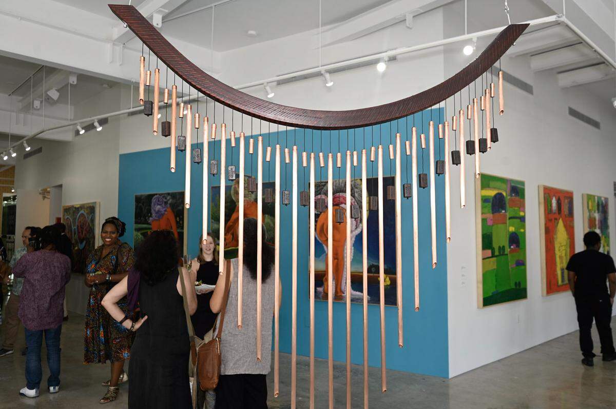 “Lift Every Voice” by artist Autumn T. Thomas on display at “Depth of Identity: Art as Memory and Archive” at Green Space Miami. The names of Black Americans who were killed by police are etched into the windchime.
