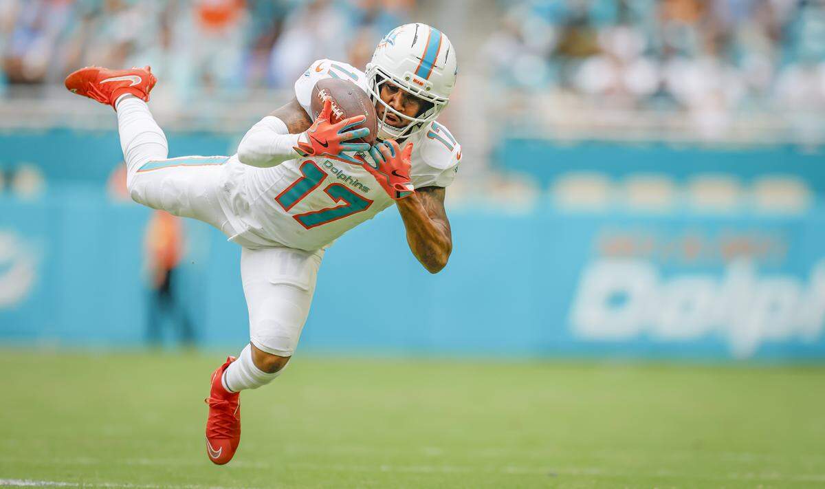 Miami Dolphins wide receiver Jaylen Waddle (17) catches a pass for a first down during their NFL football game against the Los Angeles Chargers at Hard Rock Stadium in Miami Gardens, FL, on Sunday, October 12, 2025. 
