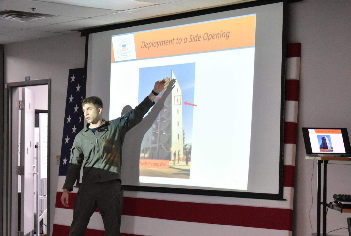 A Coast Guard instructor provides a urban search and rescue training to pilots at the U.S. Coast Guard Air Station in Opa-locka ahead of Hurricane Ian on Tuesday, Sept. 27, 2022.