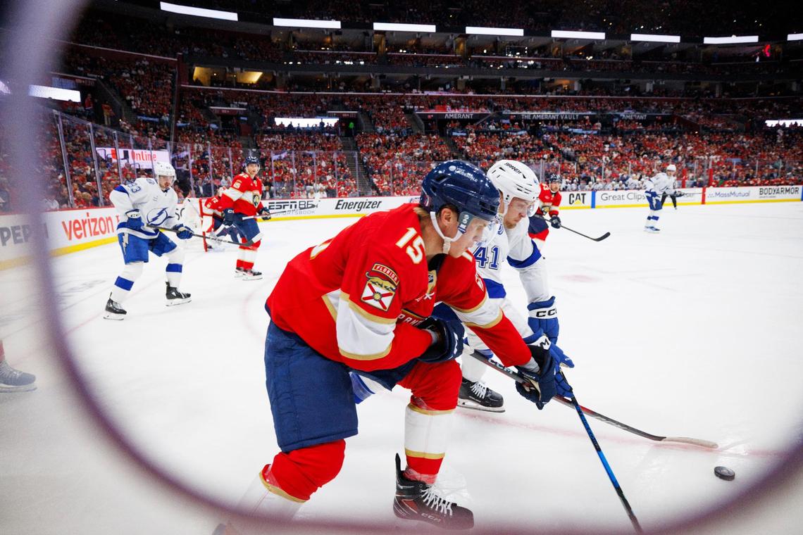 Florida Panthers center Anton Lundell (15) tries to get the puck from Tampa Bay Lightning right wing Mitchell Chaffee (41) during the second period of Game 3 of the first-round Stanley Cup playoff series on Saturday, April 26, 2025, at Amerant Bank Arena in Sunrise, Fla.