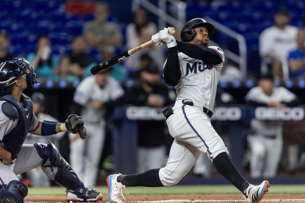 Miami Marlins shortstop Xavier Edwards (9) triples during the first inning of an MLB game against the Atlanta Braves at loanDepot park on Monday, August 25, 2025, in Miami, Fla.