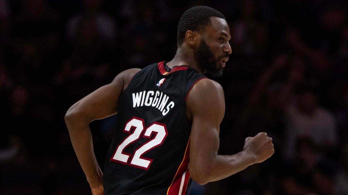Miami Heat forward Andrew Wiggins (22) reacts to scoring during the second half of an NBA game against the Charlotte Hornets at Kaseya Center on March 23, 2025, in Miami.