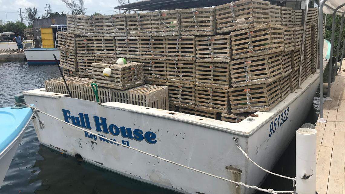 The Full House, a commercial lobster boat docked in Stock Island in the Lower Keys, sits full of traps at the beginning of this year’s spiny lobster season in August.
