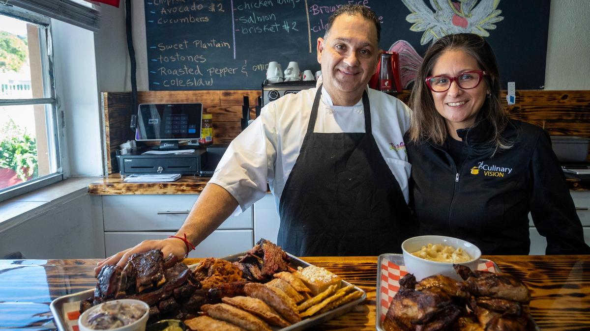 Business partners Mario Barone and Gianina Roman at La Veridica BBQ in Hialeah with the family meal called Pal Musico, which consists of four empanadas, four tequeños, one whole chicken, one sausage, half a pound of brisket, a full rack of ribs and pulled pork.