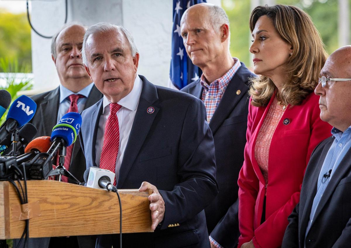 Congressman Carlos Gimenez speaks during a press conference in front of Mondongo’s Restaurant in Doral as other elected officials as well as members of the Colombian community in Miami listen, Wednesday, Jan. 26, 2022.