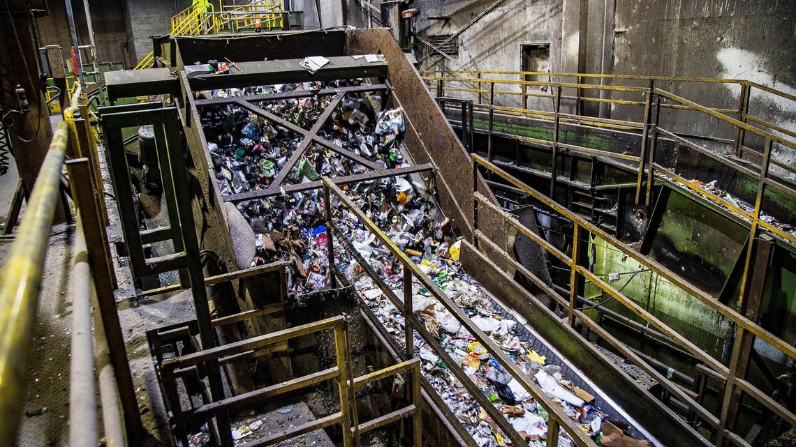 View of recycled materials traveling along a conveyor to be sorted at the Waste Management Recycling Plant in Pembroke Pines, Florida, on Friday, April 8, 2022.