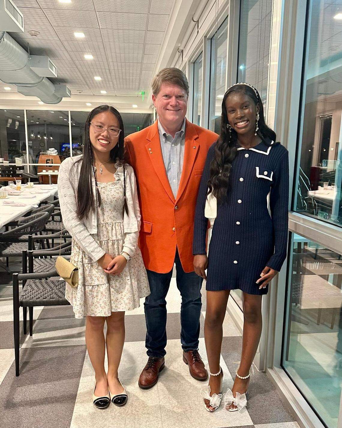 Kiwanis Treasurer and Gables Service Scholarship Administrator Doug Kellner with winners Tiffany Beh, left, and Destiny Casimir at the Awards Dinner at Birdie Bistro.
