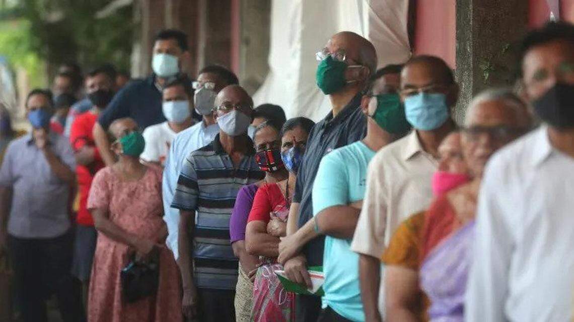 People in Mumbai, India, line up to receive a vaccination against the coronavirus in May.