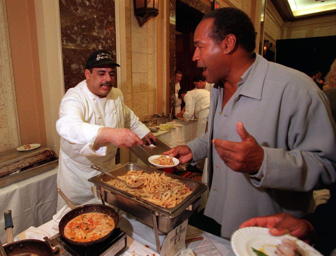 In 2000, chef Pedro Rosado serves a dish of pasta to O.J. Simpson at the Star Chefs and Wine Extravaganza at the Intercontinental Hotel in Miami.