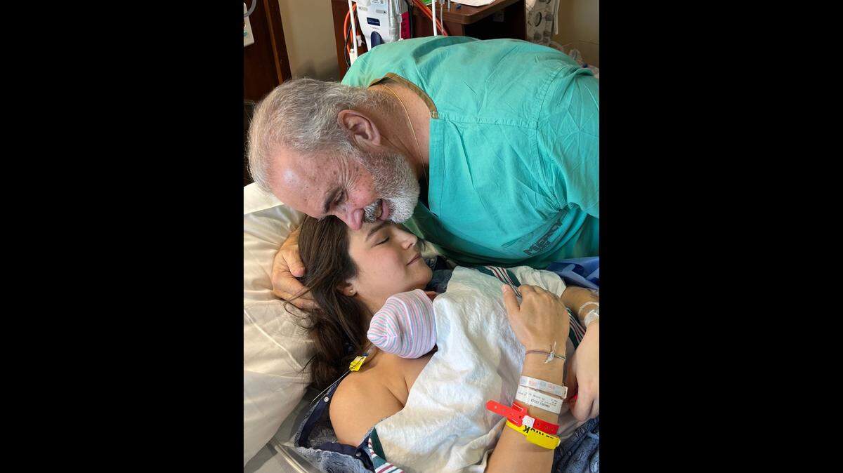 Dr. Rolando De Leon and Erica Ramirez, the first baby he delivered at Mercy Hospital, welcome her baby boy 34 years later.