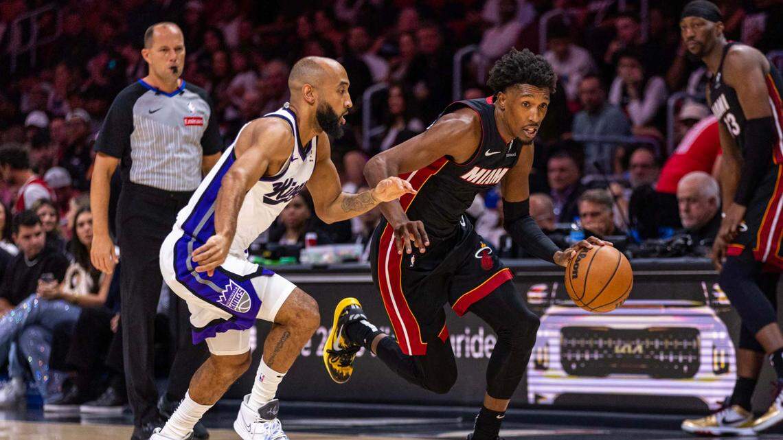 Miami Heat guard Josh Richardson (0) dribbles past Sacramento Kings guard Jordan McLaughlin (3) during an NBA game at Kaseya Center on Monday, November 4, 2024, in Miami.