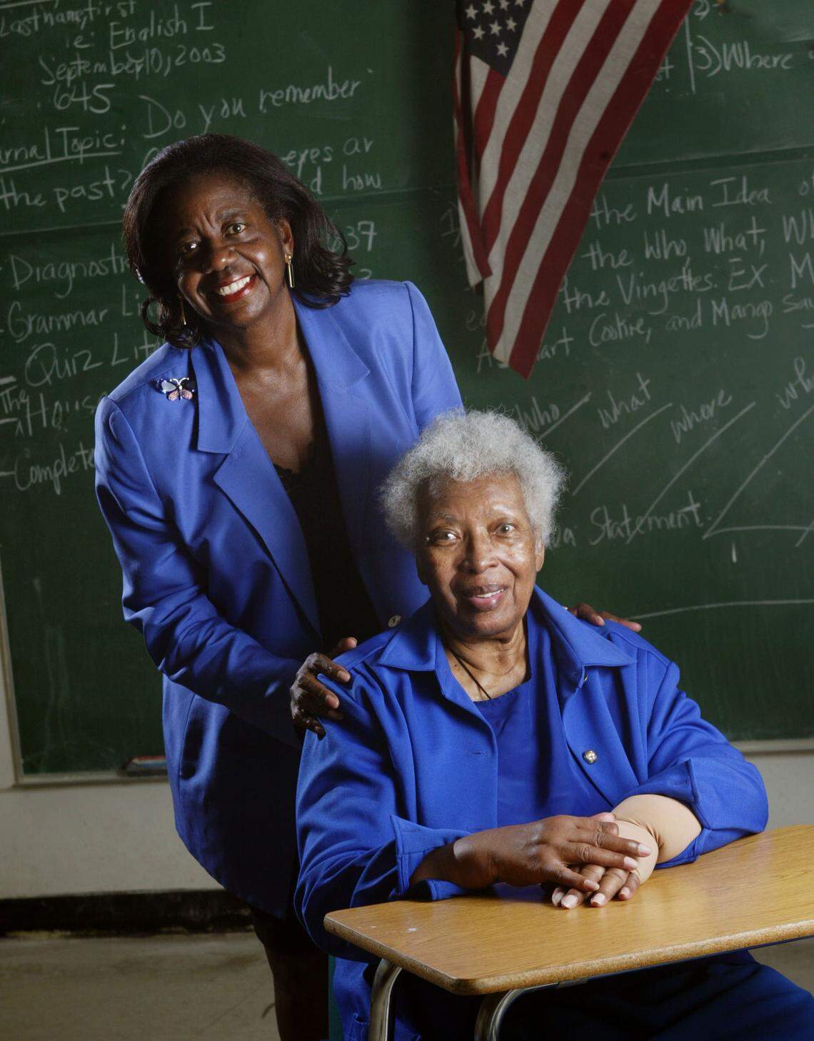 Dorothy Jenkins Fields, left, who founded Miami’s Black Archives, poses with her most influential teacher, Marian Shannon, while visiting Booker T. Washington High School in Miami in 2003.