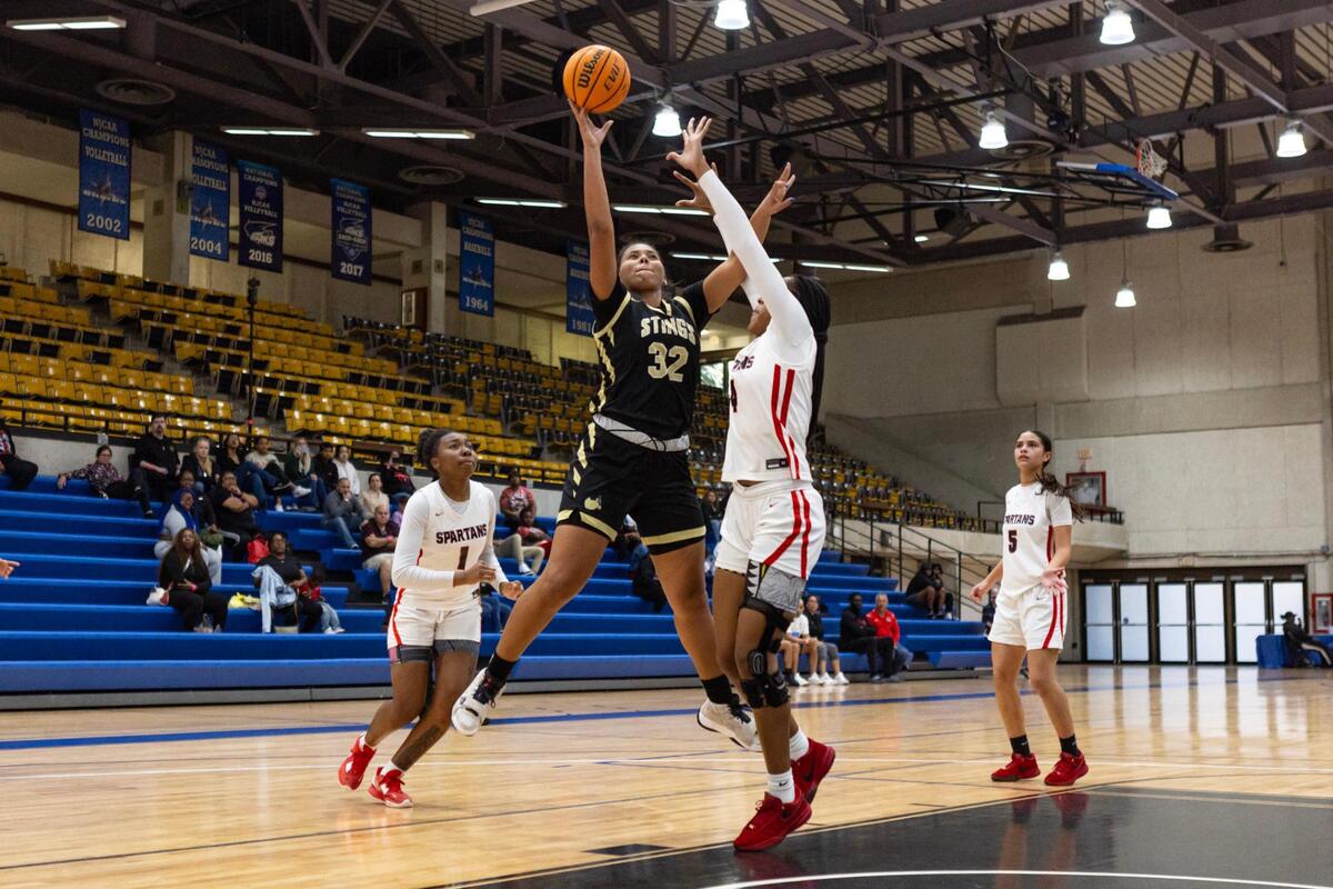 Miami High forward Nicole Penalver (32) goes up for a shot over South Ridge forward Unique Horton (4) during the second half of the GMAC Basketball Finals at Miami-Dade Kendall campus gym in Miami, Florida on Saturday, January 27, 2024.