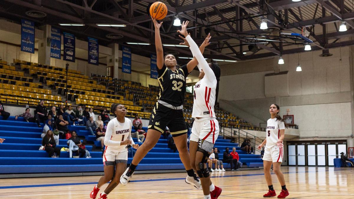 Miami High forward Nicole Penalver (32) goes up for a shot over Southridge forward Unique Horton (4) during the second half of the GMAC Basketball Finals at Miami-Dade Kendall campus gym in Miami, Florida on Saturday, January 27, 2024.