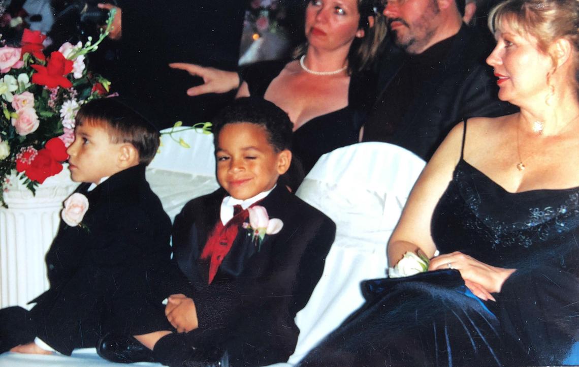 Young Nikolas and Zachary Cruz, along with their mother, enjoy a formal occasion. Lynda Cruz died late last year, leaving the brothers without parental guidance.