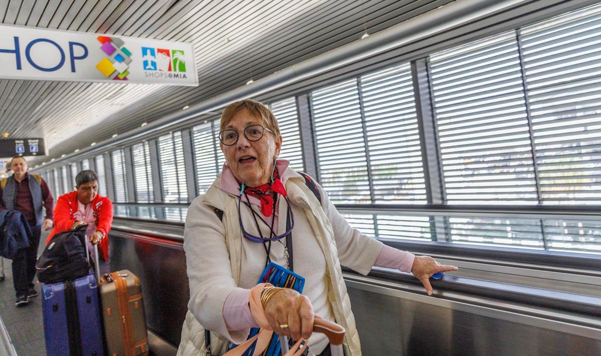 Helen Shepherd takes a ride on a working mechanical walkway after having to bypass one that didn’t function at Miami International Airport’s Flamingo Garage. On the same day, there was a press conference by Miami-Dade County Mayor Daniella Levine Cava on the county’s upgrades to infrastructure at the airport.