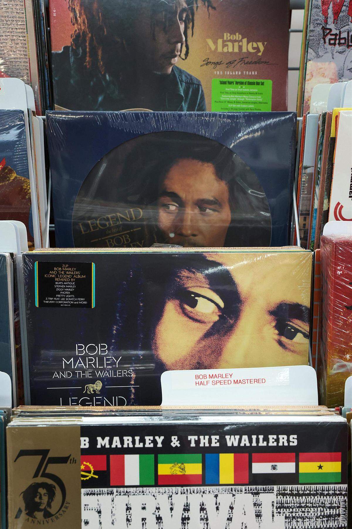 Vinyl LPs by Bob Marley fill a rack at Museo del Disco. The last big traditional record store in Miami-Dade County, Museo offers a massive selection of CDs and vinyl recordings in a wide range of genres.