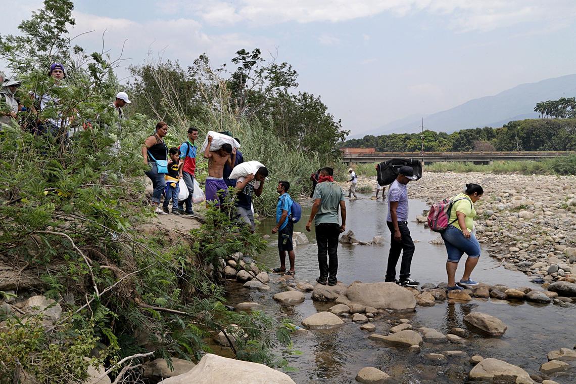 Although the borders between Colombia and Venezuela remained closed since Feb. 23, when supporters of Venezuela’s interim President Juan Guaidó tried to force humanitarian relief into the country, a constant flow of people moving in both directions is seen crossing the river along a trail called Trocha, next to the Simón Bolívar International Bridge in Cúcuta, Colombia.