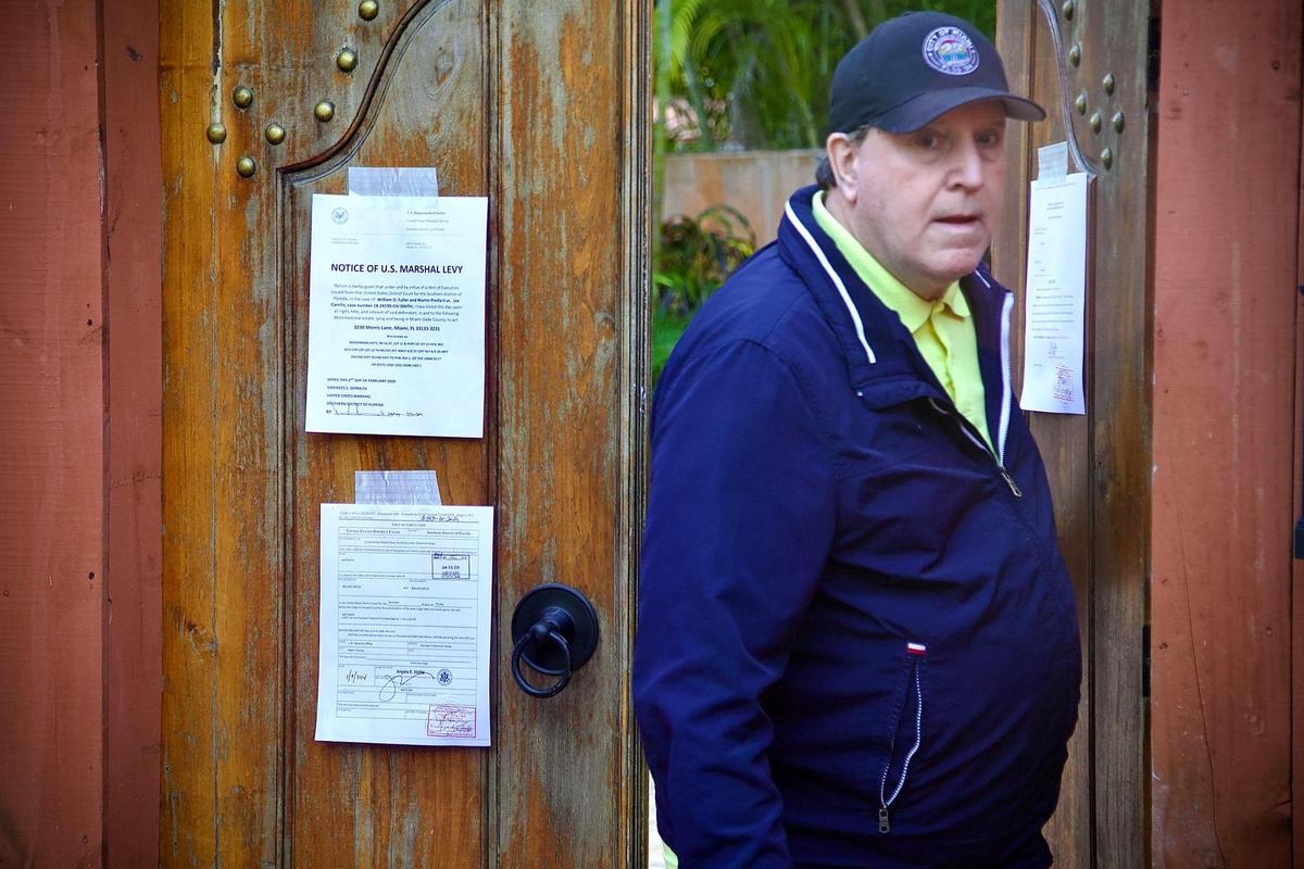 Joe Carollo comes out of his house to talk to reporters for the second time in front of his residence in Coconut Grove on Friday, Feb. 2, 2024. US Marshals seized the property of Miami commissioner Joe Carollo after he lost a civil trial accusing him of misusing his public office.