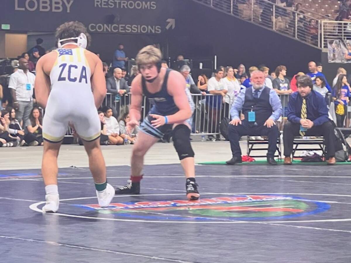 Coral Springs Charter’s Peter Mocco gets ready to square off with Zephyrhills Christian’s Jeremiah Chavis in the Class 1A 190-pound weight class state championship bout on Saturday in Kissimmee, Fla.