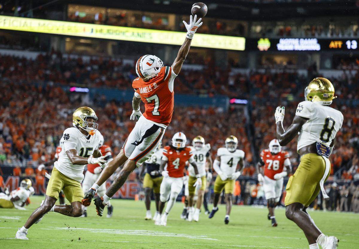 Miami Hurricanes wide receiver CJ Daniels (7) on a one handed catch for the touchdown in the second quarter against the Notre Dame Fighting Irish during an NCAA football game at Hard Rock Stadium in Miami Gardens, Florida, on Sunday, August 31, 2025.