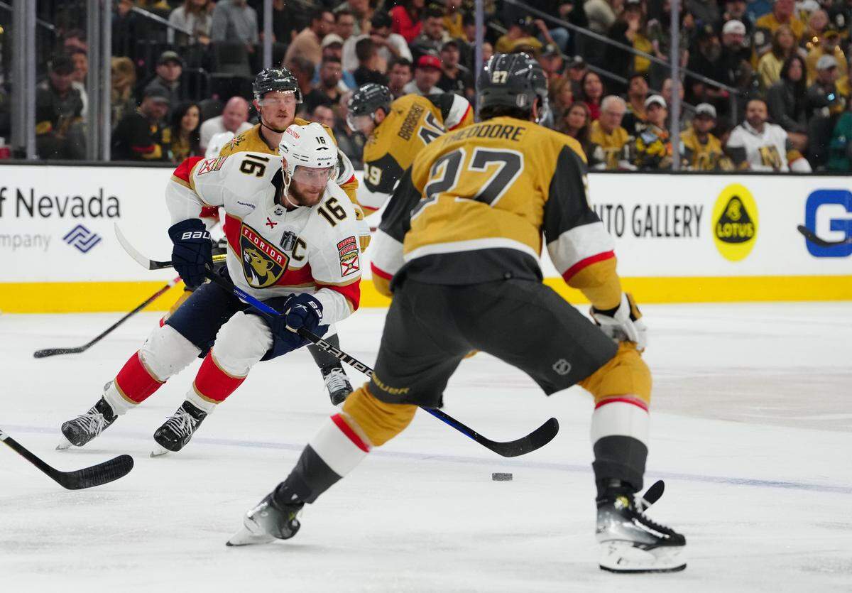 Jun 3, 2023; Las Vegas, Nevada, USA; Florida Panthers center Aleksander Barkov (16) controls the puck against the Vegas Golden Knights during the third period in game one of the 2023 Stanley Cup Final at T-Mobile Arena. Mandatory Credit: Stephen R. Sylvanie-USA TODAY Sports