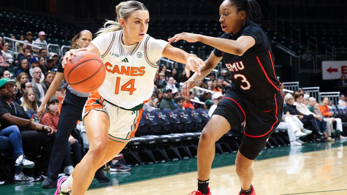 Miami Hurricanes Haley Cavinder(14) dribbles passed SMU Mustangs Nya Robertson (3) during the first quarter of a game on Sunday, Jan. 26, 2025, at Watsco Center in Coral Gables, Fla.