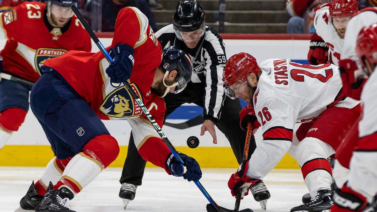 Florida Panthers center Aleksander Barkov (16) and Carolina Hurricanes center Paul Stastny (26) face off in the first period of Game 3 of the NHL Stanley Cup Eastern Conference finals series at the FLA Live Arena on Monday, May 22, 2023 in Sunrise, Fla.
